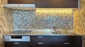 Fridge, microwave, electric kettle, cookware/dishes/utensils