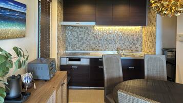 Fridge, microwave, electric kettle, cookware/dishes/utensils