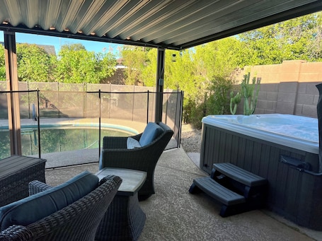 Outdoor spa tub. Private retreat with gym, hot tub, pool & playroom