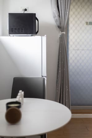 Enjoy a simple, functional space with a projector or TV for entertainment and a window with a view.