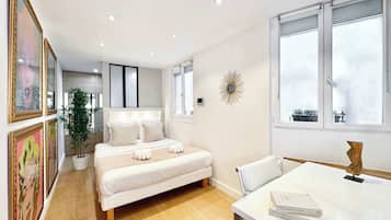 1 bedroom, desk, iron/ironing board, travel crib