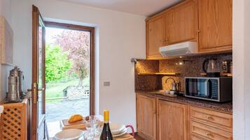 Family Apartment, 1 Bedroom (Charming Apartment with Garden in) | Private kitchen | Fridge, microwave, stovetop, espresso maker