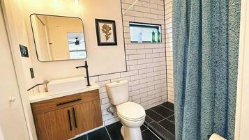 Shower, towels, soap, toilet paper