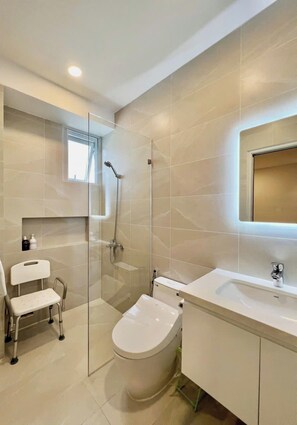 Shower, hair dryer, slippers, towels