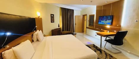 Deluxe Room, Balcony, City View | Desk, laptop workspace, free WiFi