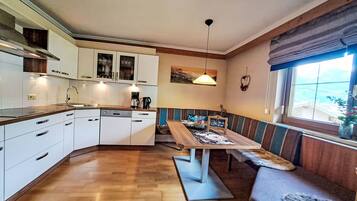 Oven, dishwasher, toaster, dining tables