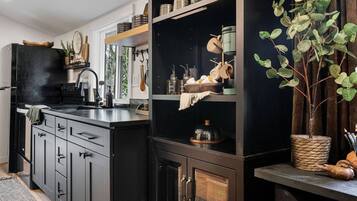 Microwave, oven, dishwasher, dining tables