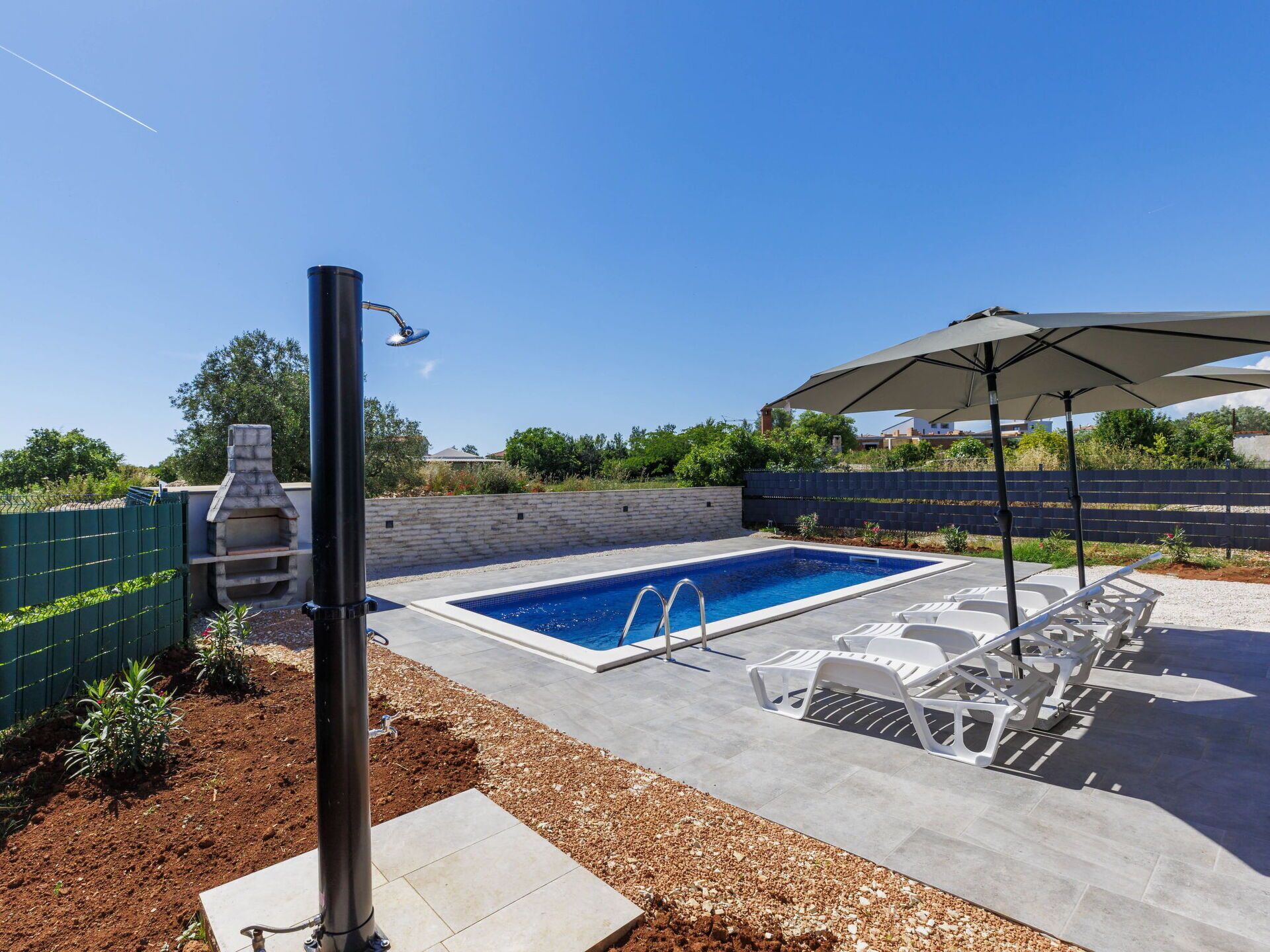 Sky, Plant, Property, Swimming Pool, Shade, Outdoor Furniture, Street Light, Sunlounger, Building, Urban Design