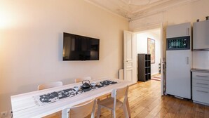 A modern kitchen with white cabinets and a built-in oven. - Central 1BR Quai de Seine in the Marais district (Paris)