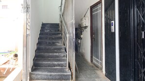 A staircase leading to a door with a security keypad.