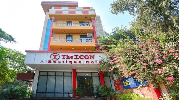 The ICON Boutique Hotel with a modern facade, balconies, and potted plants. - Fabhotel The Icon (New Delhi)