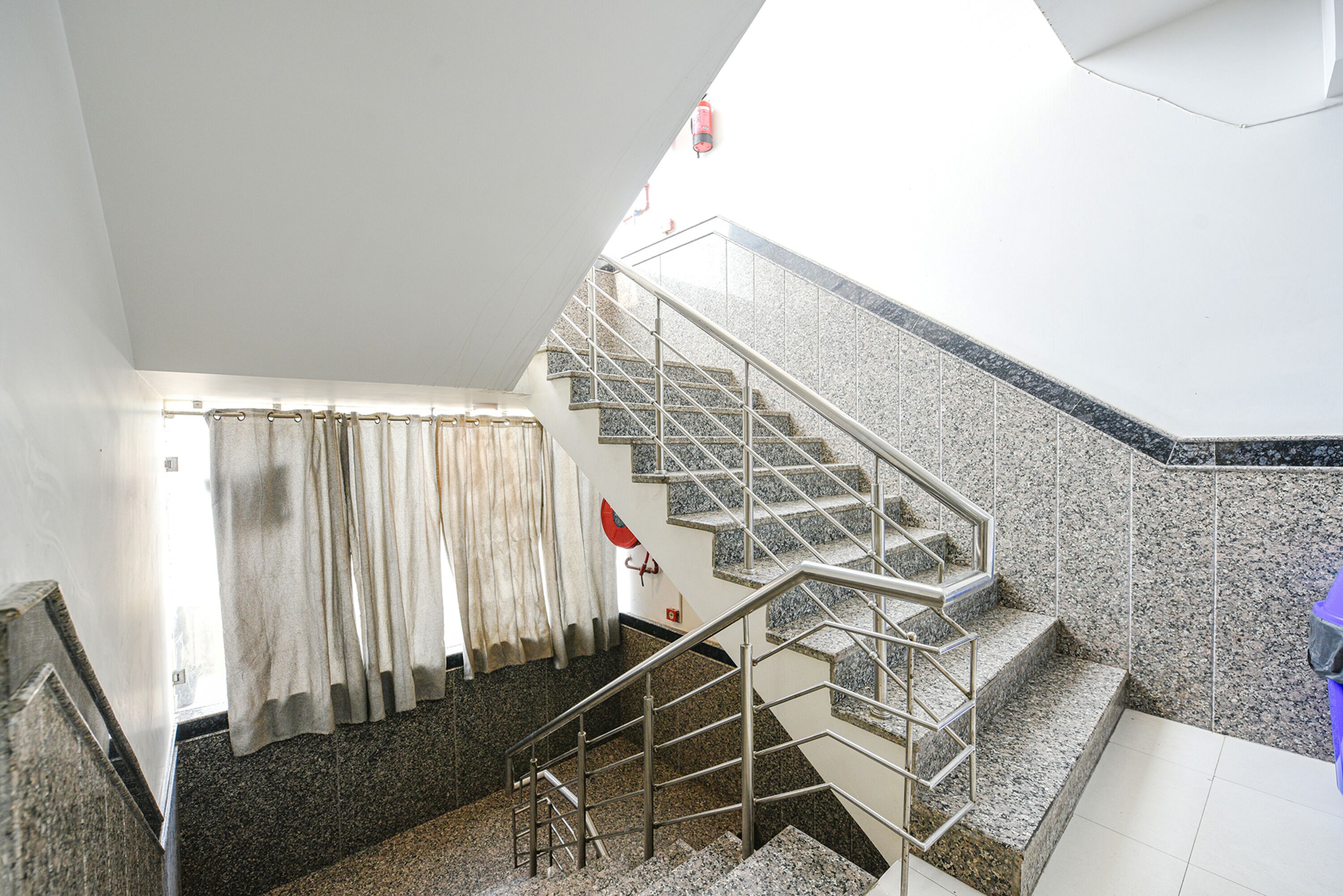 A staircase with metal railings leading to an upper floor.