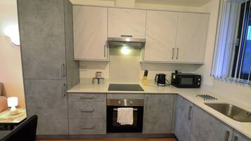 Apartment | Private kitchen | Fridge, microwave, oven, stovetop