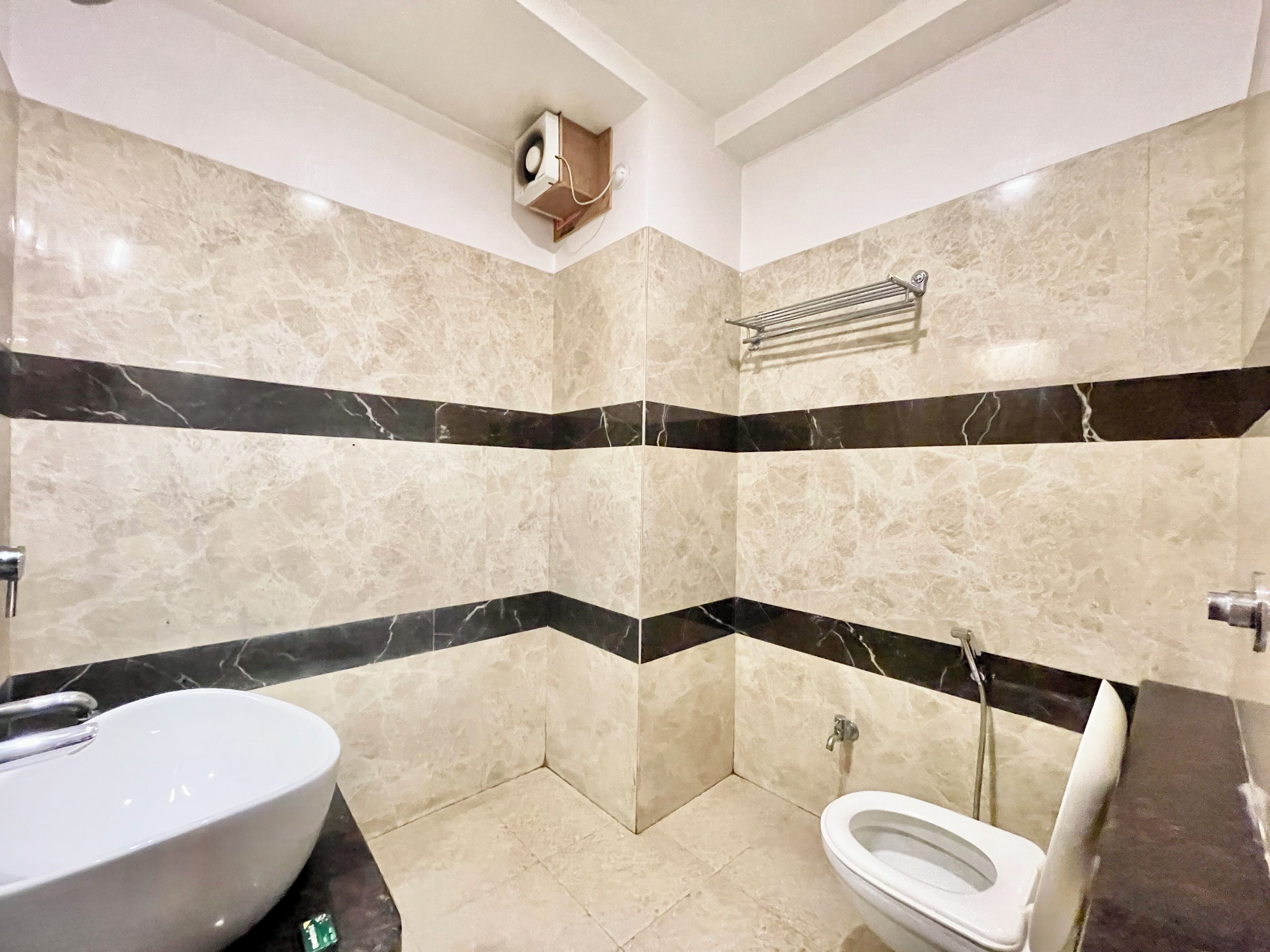 A bathroom with a bathtub, toilet, and shower.