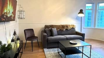 Design Apartment | Living area | 43-inch LCD TV with satellite channels