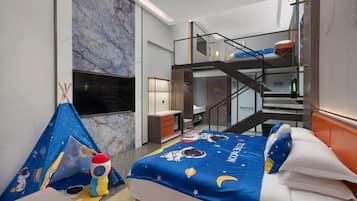 A hotel room with a bed, a TV, a balcony, and a staircase.