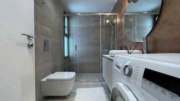 Shower, hair dryer, towels, soap
