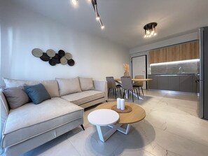 Deluxe Apartment | Living area | 49-inch Smart TV with digital channels - Urban Oasis in Ellinikon (Elliniko-Argyroupoli)