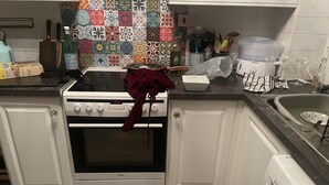 A kitchen with white cabinets, a Bosch dishwasher, and a Bosch washing machine. - Rochester Retreat - Cozy 3 Bedroom Vacation Home (Rochester)