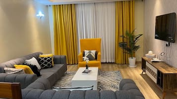 Departamento, 1 habitación | Área de sala de estar