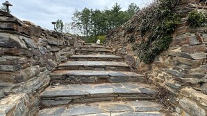 A stone staircase leading up a rocky path.