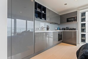 Apartment | Private kitchen | Fridge, microwave, oven, stovetop