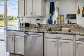 House, Multiple Beds, Pool Access, Pool View (Ella Mae Golf Villa) | Private kitchen | Fridge, microwave, oven, stovetop - Ella Mae Golf Villa - Pet Friendly (Davenport)