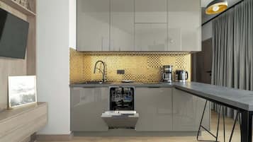 Een koelkast, een magnetron, een kookplaat, een vaatwasser