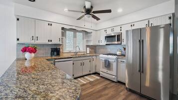 Microwave, dishwasher, coffee/tea maker, cookware/dishes/utensils