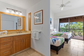 A bathroom with a vanity, sink, and towel rack. - Wailea Ekahi, #19a 2 Bedroom Condo by RedAwning (Kihei)