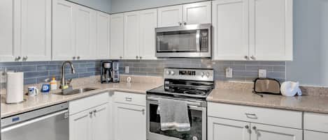 Condo, 2 Bedrooms | Private kitchen | Fridge, oven, coffee/tea maker