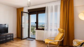 Apartment (Two Bedroom Apartment with Balcony an) | Living room | 32-inch flat-screen TV with digital channels