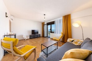 Apartment (Two Bedroom Apartment with Balcony an) | Living room | 32-inch flat-screen TV with digital channels