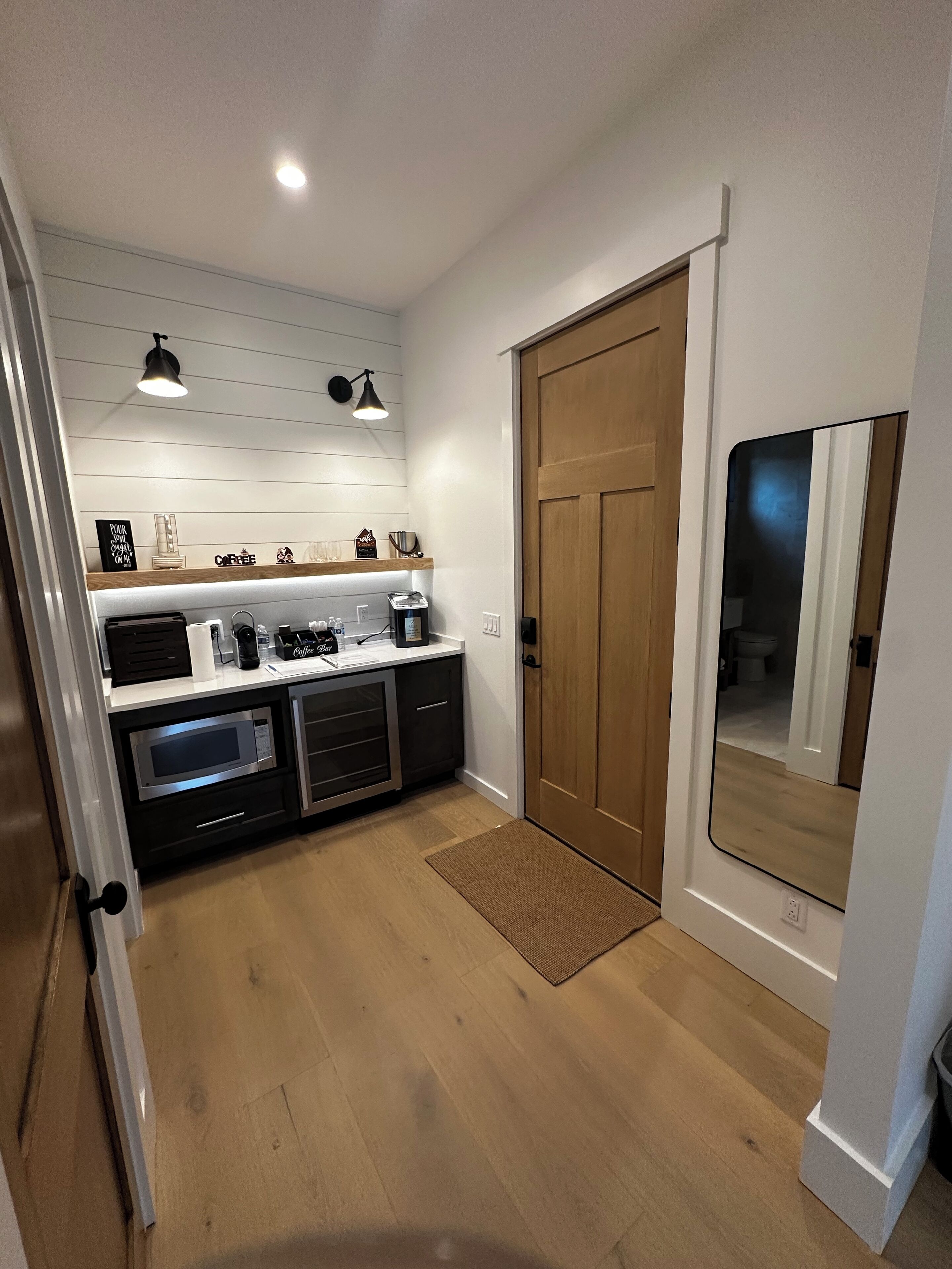 Fridge, microwave, coffee/tea maker, cookware/dishes/utensils