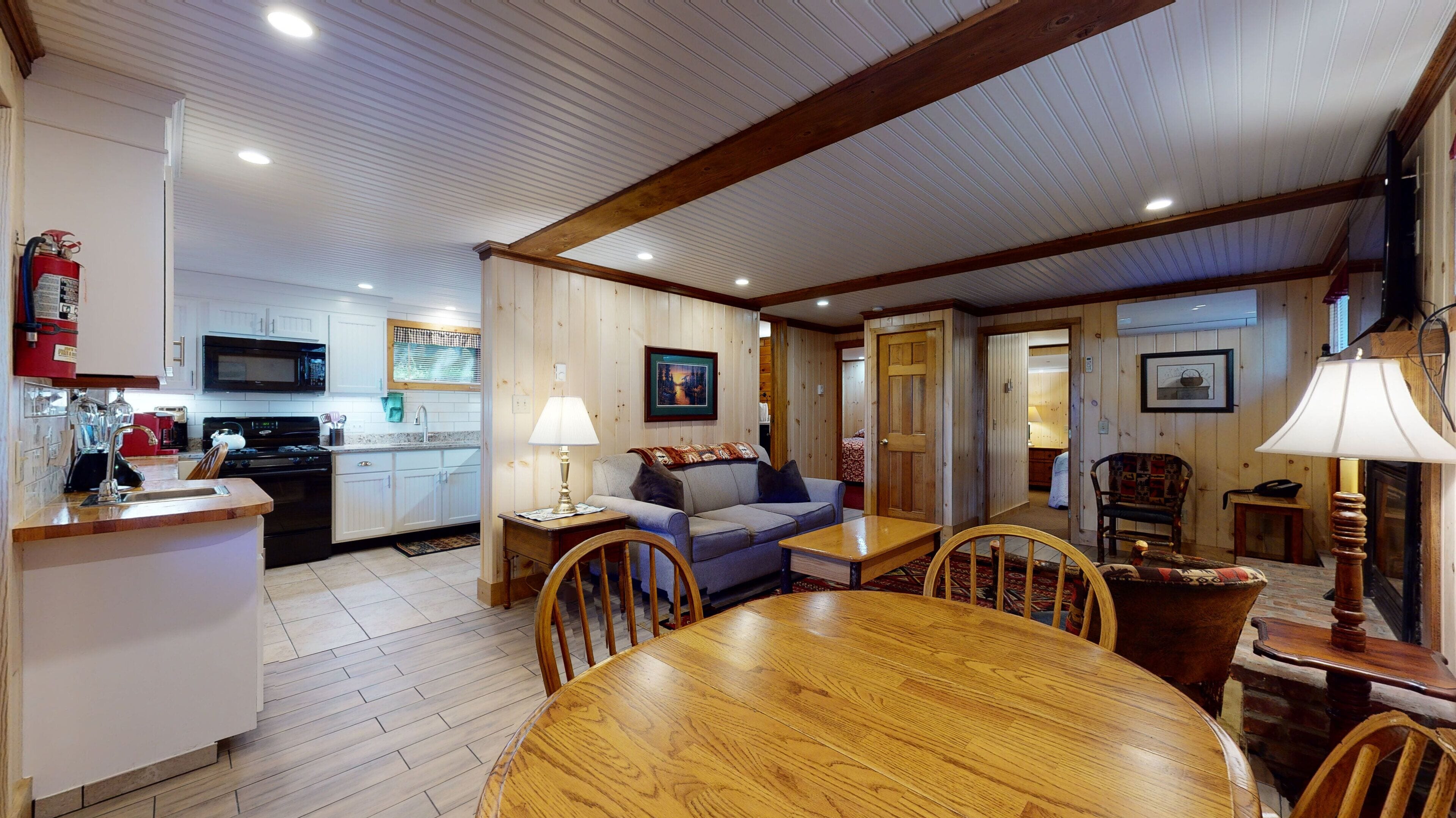 A cozy interior with a kitchen, dining area, and living room.