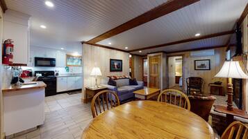 A cozy interior with a kitchen, dining area, and living room.