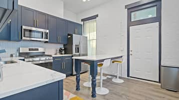 Fridge, microwave, dishwasher, dining tables