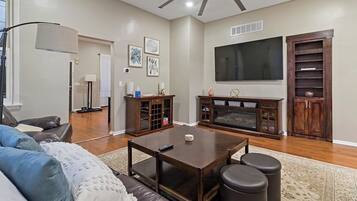 TV, fireplace, books, offices