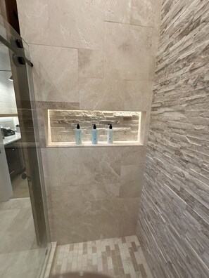 Shower, hair dryer, towels, soap