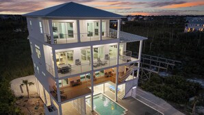 A multi-story modern house with a pool, balconies, and a view of the beach. - Secluded Dunes / Ocean Views, Pool & Beach Access (Port St. Joe)