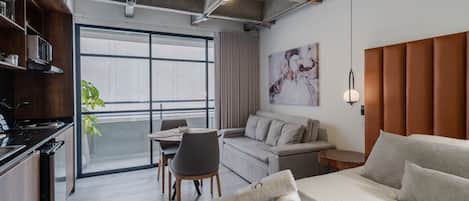 Superior Apartment | Living area | 30-inch TV with cable channels