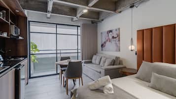 Superior Apartment | Living area | 30-inch TV with cable channels