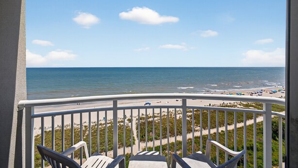 A balcony with a view of the beach and ocean. - Atlantica 903, Oceanfront Stay, Myrtle Beach Rental (Myrtle Beach)