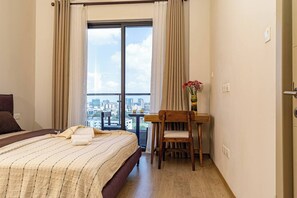 1 bedroom, desk, iron/ironing board, travel crib