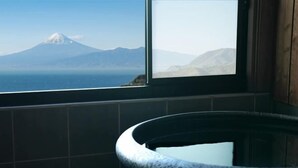 A window with a view of a mountain and a body of water. - Nishi-izu Glamping Tenkuu-Terrace (Numazu)