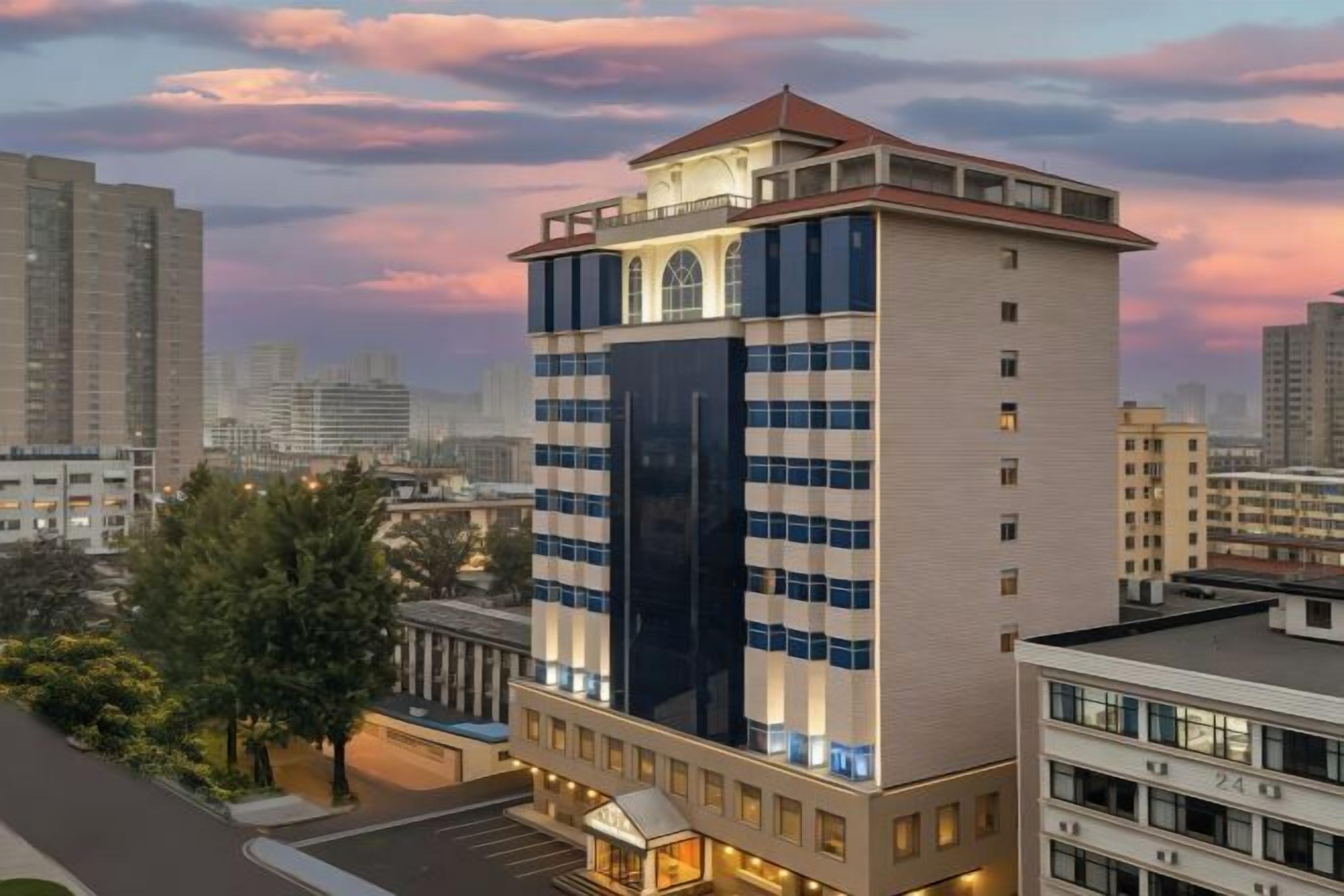 A high-rise hotel with a modern design, multiple floors, and a prominent entrance.