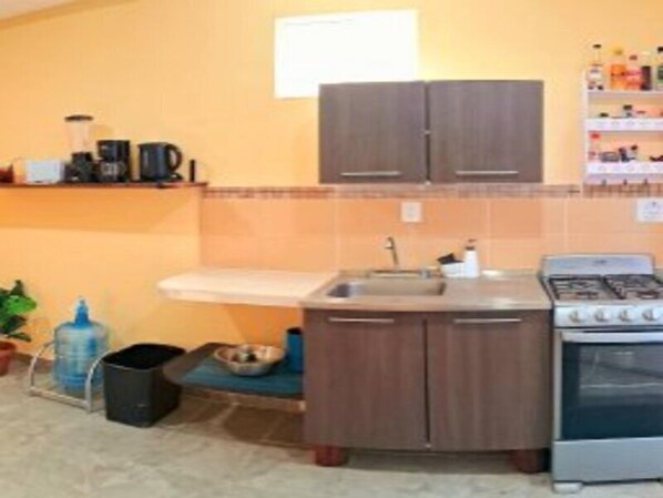 Fridge, microwave, stovetop, coffee/tea maker