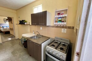 Fridge, microwave, stovetop, coffee/tea maker