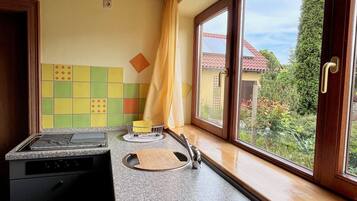 Fridge, microwave, stovetop, coffee/tea maker