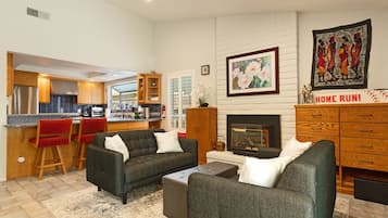 Smart TV, fireplace, books, offices